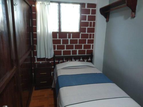 Tempat tidur dalam kamar di Casa personal o familiar para vacacionar en Yurimaguas