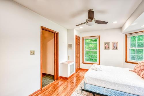 a bedroom with a bed and a ceiling fan at All Sun and Games in Mineral