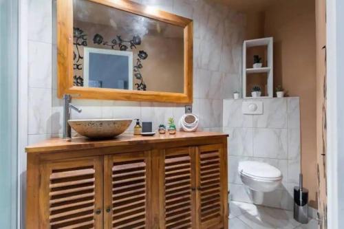 a bathroom with a sink and a toilet at Historic Villefranche Penthouse, Steps to Beach in Villefranche-sur-Mer