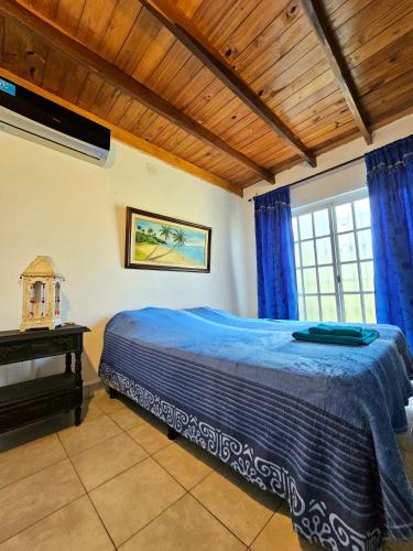 a bedroom with a bed and a piano at La joyita in Ituzaingó