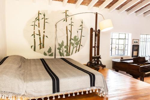 Säng eller sängar i ett rum på Bajo el Ciruelo