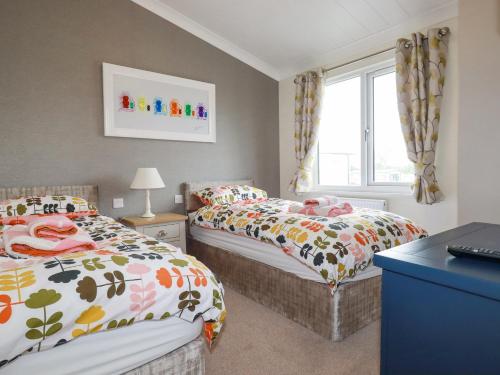 Postel nebo postele na pokoji v ubytování Mordros Lodge