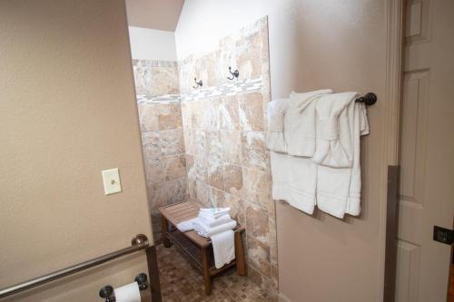 a bathroom with towels hanging on a wall at Dolly Bear Mountain View in Sevierville