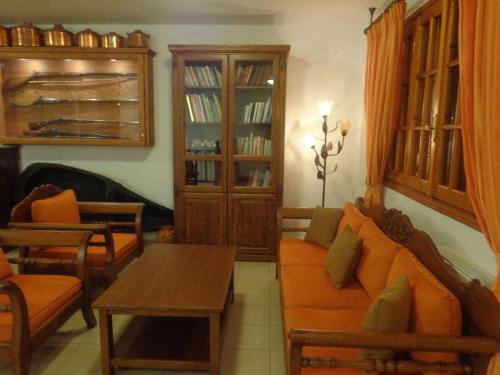 a living room with a couch and a table at Faros in Milopotamos