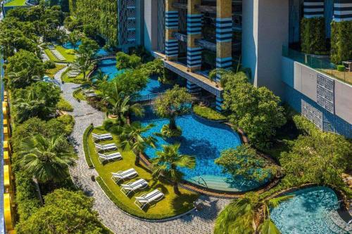 an aerial view of a resort with a swimming pool at The Riviera Jomtien one bedroom in Jomtien Beach