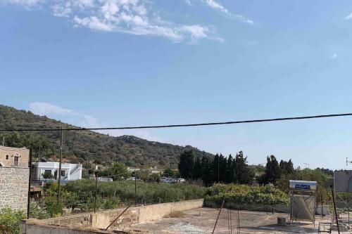 a view of a city with a mountain in the background at Medieval House in Mesta