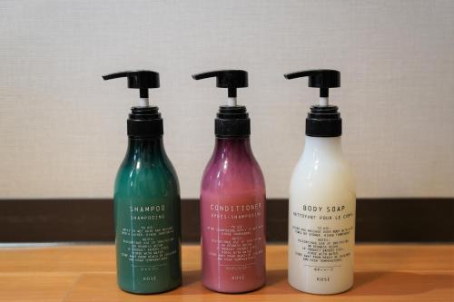 a group of three bottles sitting on a table at Hotel Katsuyama Premiere in Matsuyama