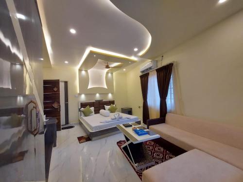 Ein Bett oder Betten in einem Zimmer der Unterkunft Hindusthan Inn - On Beach