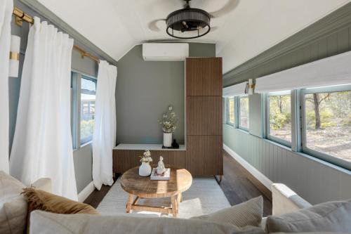 a living room with a couch and a table at The Station Hunter Valley in Pokolbin