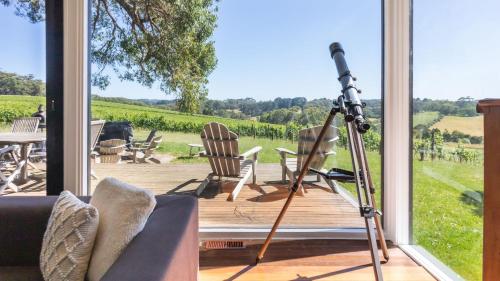a camera on a tripod on a deck with a view at Bellas Block in Shoreham