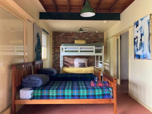 a bedroom with a bunk bed in a room at Balclutha in Point Lonsdale