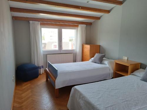 Postel nebo postele na pokoji v ubytování Apartamento Os Pineiros Cambados