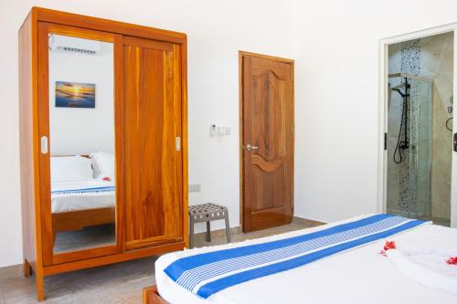 Ένα ή περισσότερα κρεβάτια σε δωμάτιο στο Macmillan's Holiday Villas