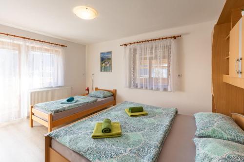 Postel nebo postele na pokoji v ubytování Apartmaji Matej Cvetek