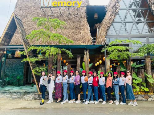 a group of people standing in front of a building at Phong Nha Memory Homestay in Phong Nha