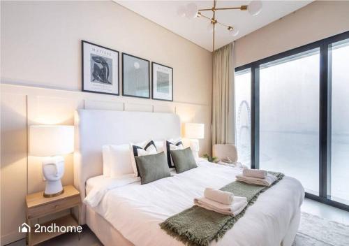 Postel nebo postele na pokoji v ubytování Full Ain Dubai View - The Address Beach Residence