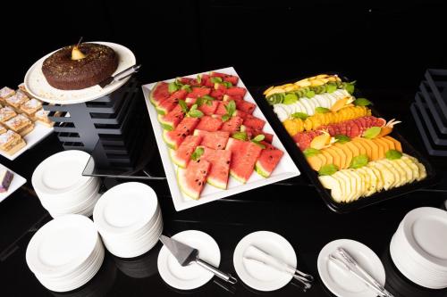 a table with a bunch of different types of food at Hotel Meta Resort & Vine SPA in Szczyrk