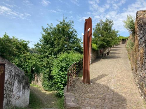 a sign on the side of a road at Gîte Le Sambre in Thuin