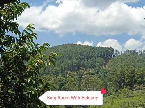 a mountain with a sign that reads king room with bakery at The Rock Face in Ella