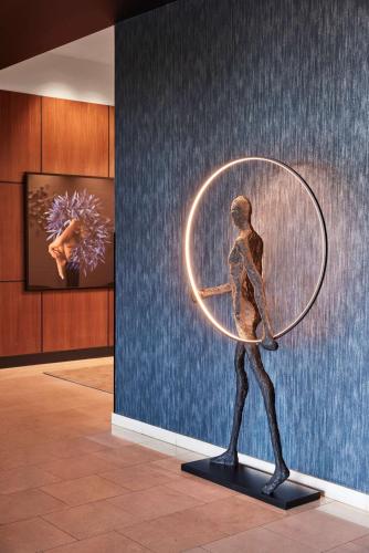 a statue of a man in a hula hoop at Adina Apartment Hotel Melbourne Flinders Street in Melbourne