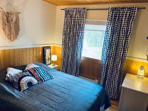 Postel nebo postele na pokoji v ubytování Northern Light Villa Ylläs with a Jacuzzi