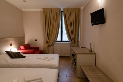 Postel nebo postele na pokoji v ubytování Villa Lomellini