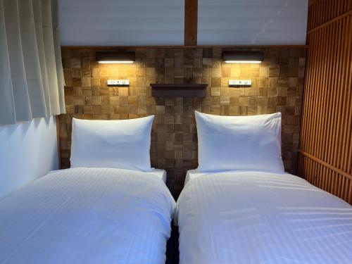 Tempat tidur dalam kamar di Quaint House Naoshima