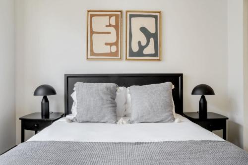 a bedroom with a large bed with two night stands at Bellevue 2br w yoga studio nr restaurants SEA-628 in Redmond