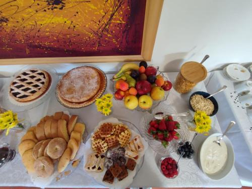 a table topped with lots of different types of food at La Casetta di Nerina - Agripark in Cansano