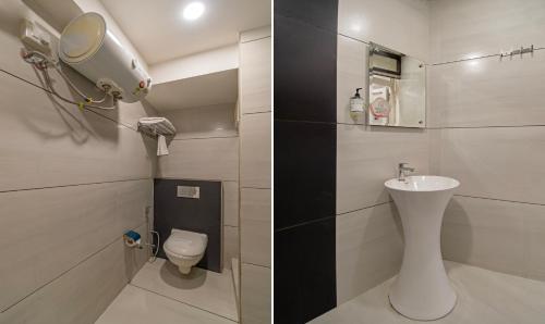 a bathroom with a white toilet and a sink at Itsy Hotels P Grand in Ludhiana