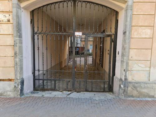 an entrance to a building with a metal gate at Fantastic Apartments - KP69 Room - A in Warsaw