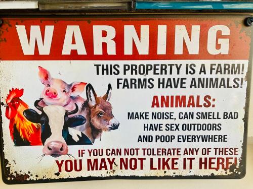 a sign that has animals on it at Sandalwood Downs Fabulous Farm Stay TOODYAY in Toodyay