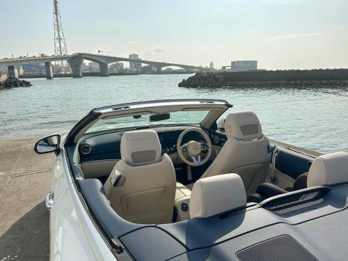a car parked next to a body of water at JAPAVISTA Casa De Boss in Naha