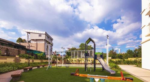 a playground with a slide in a park at Casa Concha by Celandine private residences in Manila
