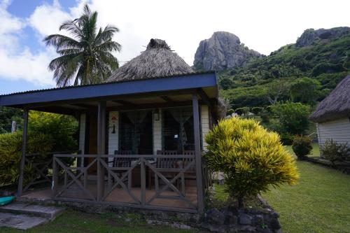 a small cottage with a thatched roof at Waya Lailai Eco Haven in Wayasewa Island