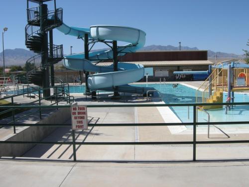 a water slide in a swimming pool with a no swimming sign at Nevada Mesquite Vacation Rentals in Mesquite