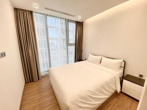 En eller flere senger på et rom på Vinhomes Metropolis Hanoi Apartment Hotel