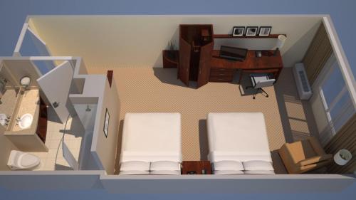 an overhead view of a living room with two white chairs at Courtyard by Marriott Birmingham Downtown at UAB in Birmingham