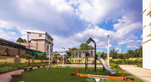 a playground with a slide in a park at Casa Concha by Celandine in Manila