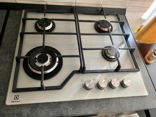 a stove top oven with four burners on it at “Home sweet home” in Sîntandrei