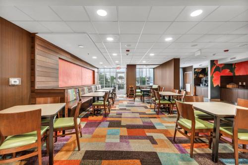 a dining room with tables and chairs at Fairfield Inn by Marriott Lumberton in Lumberton