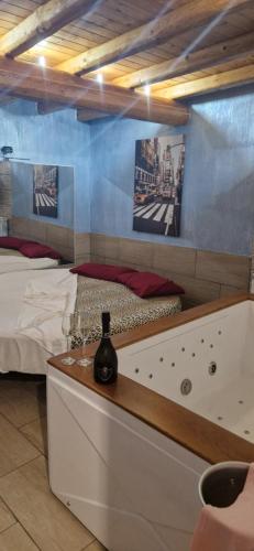 a bedroom with a bed and a bath tub at B&B Mongibello in Viagrande