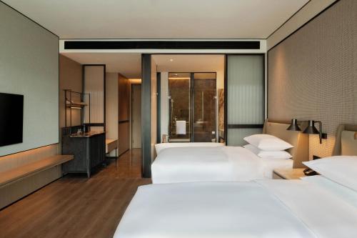 Postel nebo postele na pokoji v ubytování Sheraton Taizhou