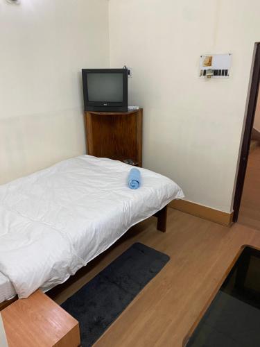 Una cama o camas en una habitación de Hotel Mayur