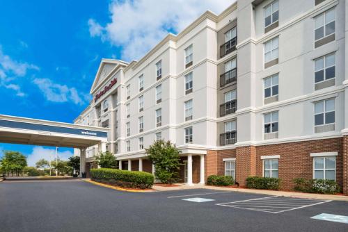 a rendering of the front of a hotel with a parking lot at Hampton Inn and Suites Fredericksburg in Fredericksburg