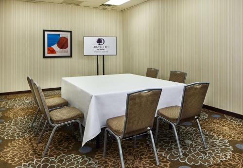 a conference room with a white table and chairs at DoubleTree by Hilton Ontario Airport in Ontario