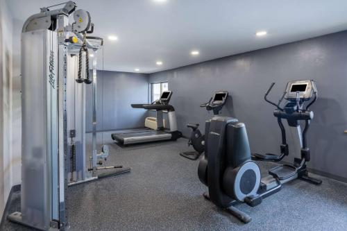 a gym with treadmills and elliptical machines at Days Inn by Wyndham Pleasant Prairie Kenosha in Kenosha