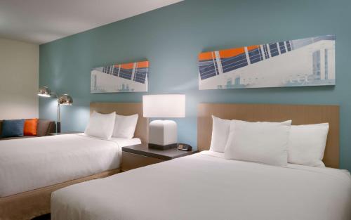 Postel nebo postele na pokoji v ubytování Hyatt House Provo/Pleasant Grove