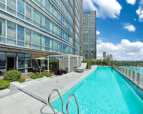 a swimming pool on the roof of a building at Hyatt Regency Shanghai Songjiang in Songjiang