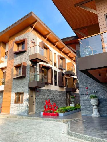 a building with balconies on the side of it at Bpod Baguio in Baguio